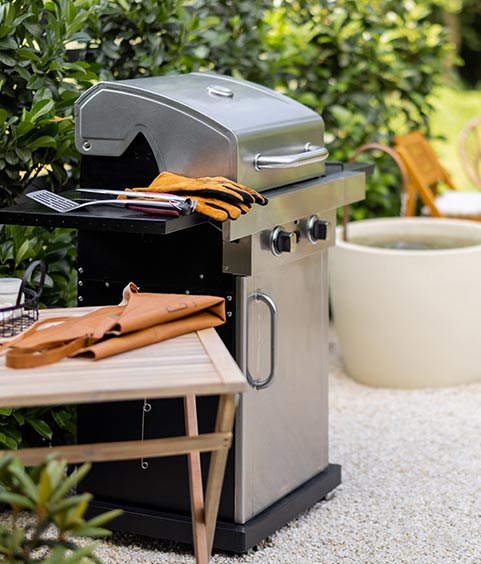 Beautiful backyard with barbeque area and dining table