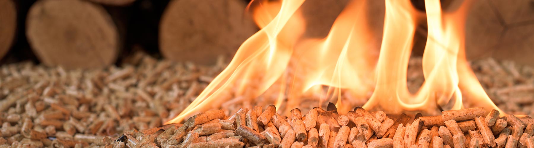 Coniferous wood pellets in flames
